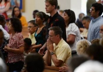 people praying together in church